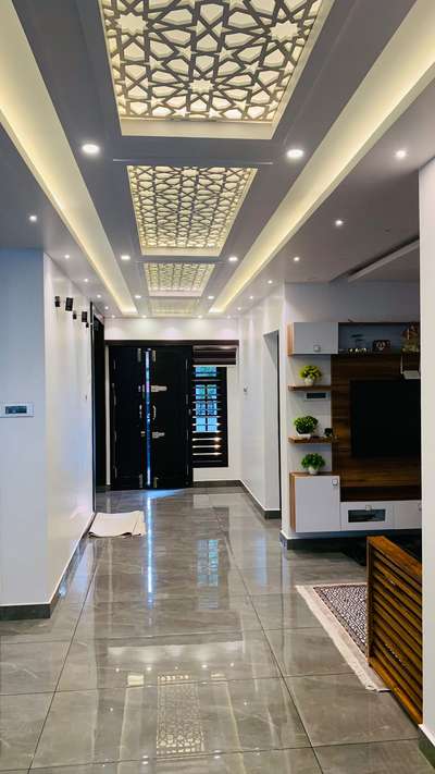 This is a stunning interior design by Evolve Interiocrat 🪄

The design features a modern and elegant hallway with polished, reflective floor tiles that enhance the spacious feel. The ceiling is adorned with intricate, geometric patterns illuminated by soft, ambient lighting, creating a luxurious atmosphere 🤍

#luxuryliving
#interiordesignexcellence
#timelesselegance
#innovativedesign
#dreamhome
#interiorinspiration
#homedecor
#craftsmanship
#designgoals
#interiordecor
#homedesign
#creatingbeautifulspaces
#styleandsubstance
#highendliving
#masterpiece
#creativespaces
#modernluxury
#elegantinteriors