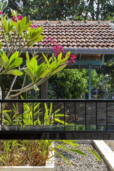 DHVANI

Residence for Mr.Ummer
Renovation project
Site area : 20cents
Building area : 2800sq.ft
Budget : 32 lakh

DHVANI is a renovation project that is set up with atmost serenity within a one acre plot beautifully landscaped in such a way that it oozes out the beauty of nature. The locality is an averagely populated residential area in the outskirts of the city. The structure is facing the southern side and there road runs to the East of the residence. The residence is designed as a perfect home for a family of five. The ground floor comprises of a sitout area in close touch to the beauty of the landscaping, a formal and family living and dining space designed with a concept of tropical modernism the concept evidently reflects over the colors and the furniture that is used in the interiors. The area is designed spaciously as it can be considered as a gathering space for functions as per the client's request. There are two bedrooms with bath attached and a Kitchen and work area and st