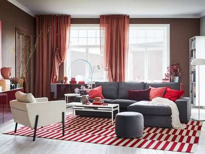 Get this living room that lets you express yourself. Drape your curtains in your own unique way. Add cushions in shades of red, a beautiful striped red carpet, matching lamps and a trendy glass vase to complement the gray sofa.
#interior #decor #ideas #home #interiordesign #indian #colourful #decorshopping