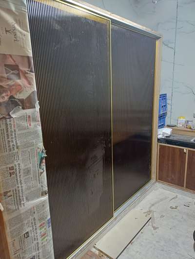 sliding wardrobe with fluted glass with profile frame shutter