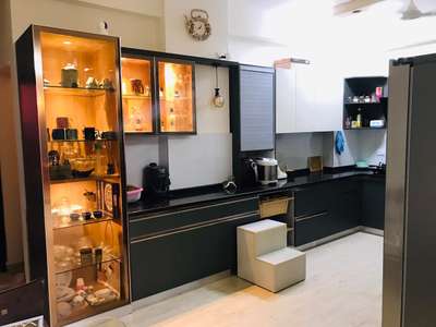 modular kitchen with crockery unit .