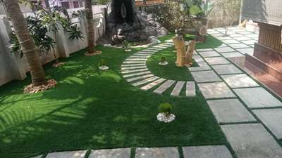 Greenlandscaping professional landscaper...This stone is Bangalorestone granite it's a long life stone and the garden using grass Fibre 35mm thickness grass 5 years warranty providing Greenlandscaping company ...contact 9526061555,8547439388  #50LakhHouse  #architecturedesigns  #Architect  #LandscapeDesign    #grass
