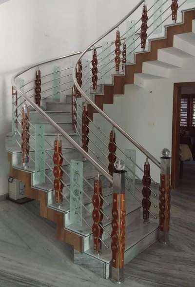 WOODEN STEEL HANDRAILS TEAK WOOD ,304GRADE STEEL AND 8MM GLASS
 #StaircaseDecors  #HouseDesigns  #GlassHandRailStaircase  #GlassHandRailStaircase  #StainlessSteelBalconyRailing   #GlassStaircase  #StaircaseDesigns