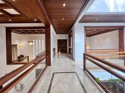 The residence  in Pavaratty, Kerala showcases classic luxury  within  its elegantly  exterior.
The client  wanted a classic elegant yet functional home where cross ventilation  and maintenance  of privacy were to play a vital role.The wooden interior  crafts a luxury look into the facade .While keeping things elegant,  simple,functional and practical .The interior injects enough style using handpicked  quality accessories. The piece of resistance is the flamboyantly designed  green courtyard that sits in the center of the house, illuminated  by the natural sunlight  received  from the overhead skylight. Some of the amenities  include  gazebo, patio, landscaping, interiors designed and advanced security installation. 

Area : 6500sqft
Client : Nisumon
Architect : Fairooz
Interior design and execution :  ECOSCAPE architecture interior innovation, Pavaratty 
Mob - 9633070602,7593911213



Please contact  us: Email: ecoscapepvt@gmail.com 
Follow us on 
Youtube : https://youtube.com/user/ju