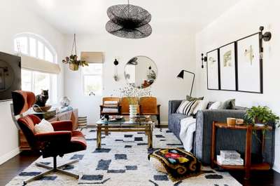 Get this mid-century modern design where modern meets cozy. Decorate your room with a round wall mirror, hanging planter, and trendy vases. Use hits of black like the black pendant lamp, floor lamp, wall frames, and rug to add some awesome visual weight and probably some needed contrast to your space.
#interior #decor #ideas #home #interiordesign #indian #colourful #decorshopping