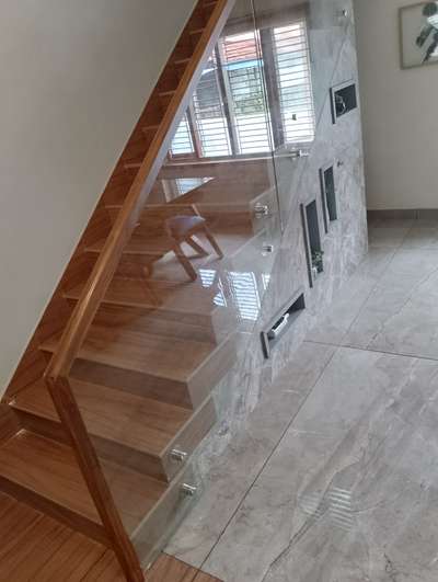 completed at Payyannur...Glass Handrails with teakwood...and Safety glass on Dining Table... #GlassBalconyRailing  #GlassStaircase  # Kasaragod
 #KitchenIdeas  #glasswork