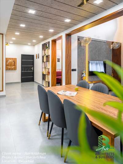 A minimal yet inviting dining space, defined by clean lines, wooden warmth, and seamless connection to the kitchen and living areas.

Project Name: Harikrishna
Client: Mr. Hari Krishnan
Location: Palakkad
Size: 4BHK | 2965 sq.ft
Completion: April 2023