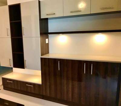 A crockery unit is placed near the dining table in the open kitchen, providing a convenient spot for serving dishes. It also includes an optimized storage unit.


silent valley interiors
work done at Skyline Apartments at Elamakkara