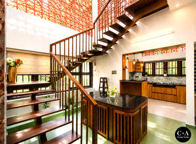 “A home where light, air & design meet beautifully ✨!

Mr. Anuraj Residence | Cherthala
A thoughtfully designed residence blending modern functionality with warm, earthy aesthetics. The space highlights natural light, ventilation, and material harmony, creating a calm and inviting living experience.
The double-height area with jaali wall design enhances airflow and diffused daylight, while the wooden staircase and textures add richness and warmth to the interiors. Carefully curated elements and greenery bring a subtle connection to nature.
Designed & Executed by C+A Design Studio
📍 Location: Cherthala
📐 Project Type: Residential Interior & Architecture
✨ Style: Modern with Traditional Touch

#C+ADesignStudio
#KeralaHomes
#KeralaArchitecture
#CherthalaHomes
#DreamHomeKerala
#ModernKeralaHome
#HomeDesignIndia
#InteriorDesignKerala
#HouseDesignInspiration
#IndianHomes
#LuxuryHomesKerala
#MinimalDesignIndia
#ContemporaryKerala
#ArchitectLife
#ResidentialDesign
#HomeGoalsIndia
#JaaliDesi