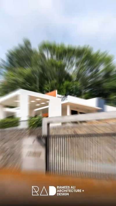 A home designed to sit gently within the landscape, where clean lines, natural textures, and openness create a calm living experience.

#modernarchitecture #minimalhome #keralahomes #rad #rameesali