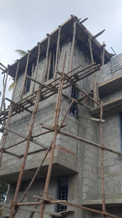 Concrete pouring on stair room top , parapet slab .