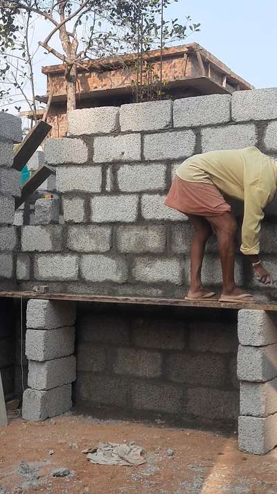 Block work & window installation for a residential building .