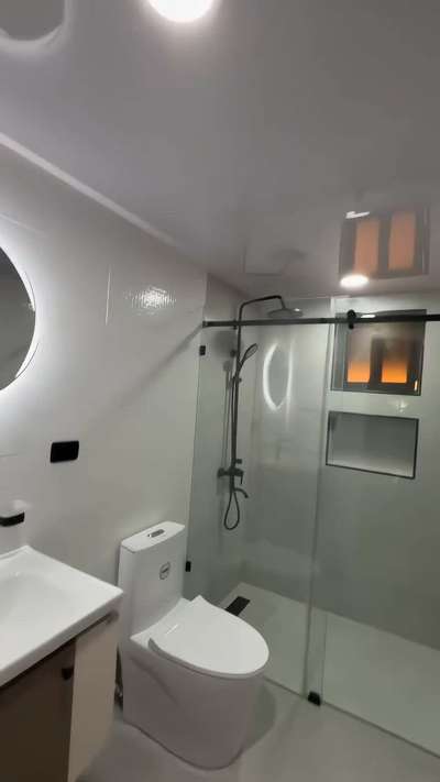 ചെറിയ bathroom ആണെങ്കിലും ശരിയായ design + fittings കൊടുത്താൽ classy look കിട്ടും!

🪞 Light White + Light Grey combo → fresh & spacious feel
🟤 Brown Vanity with Counter Wash Basin → premium highlight
⚫ Black Pillar Cock + Round LED Mirror → modern touch
🚽 White One-piece Closet → neat & compact
🚿 Glass Partition with Black Shower Rod Set → stylish separation
🕳️ Black Shower Drain → detailing complete look

👉 Budget-friendly range-ൽ തന്നെ beautiful mid-range bathroom ready!

💡 BLUE NORTH BATH-ൽ നിന്നു നിങ്ങൾക്ക് കിട്ടുന്നത്:
✔️ Quality sanitary ware
✔️ Stylish vanity cabinets
✔️ Black fittings full set
✔️ Total bathroom designing support

📲 നിങ്ങളുടെ construction plan-നു best fittings വേണോ? ഞങ്ങളെ ബന്ധപ്പെടൂ!
#LuxuryBathroom #BlueNorthBath #KeralaInteriors #HomeDesignKerala #SanitarySolutions #TrendingInteriors