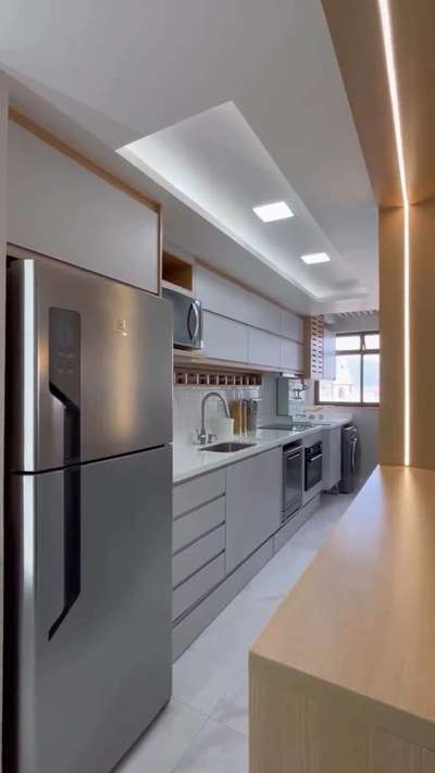 Parallel kitchens, also known as galley kitchens are modern kitchen design concepts where two kitchen platforms, along with crafty cabinets run parallel to one another. They’re gaining popularity, especially with small apartment dwellers hand over fist.

#parallelkitchen 
#KitchenIdeas 
#KitchenIdeas