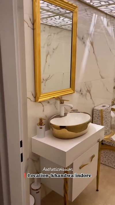 "Step into luxury with our golden and white-themed bathroom, where elegance meets modern design. The false ceiling with acrylic sheet adds the perfect touch of sophistication and style. A space that redefines relaxation!  #astheticvission #Indore  #khandwa  #LuxuryBathroom #GoldenAndWhite #AcrylicCeiling #ModernDesign #BathroomGoals #InteriorInspiration #SophisticatedLiving #LuxuryInteriors #BathroomDesign #OpulentSpaces"