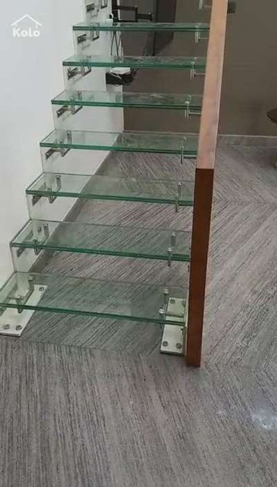 24MM TEFLON GLASS STEP WITH 12MM TEFLON GLASS AND IRUL WOOD HANDRAIL
site location:- areekode Malappuram