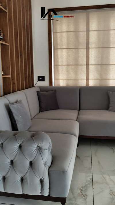Your dream living room awaits! 🏡💖 With a large sectional couch and a refreshing fan, comfort is just a seat away. What’s your must-have living room item? Comment below! #InteriorInspo #livingroomstyle