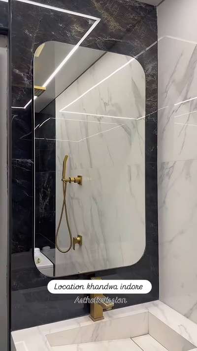 For an ultra-luxury bathroom featuring a golden tap, luxury POP false ceiling, and premium materials, the right hashtags can help target your desired audience on social media. Here are some suggested hashtags:

### Hashtags:
1. **#LuxuryBathroom**
2. **#BathroomDesign**
3. **#MarbleBathroom**
4. **#GoldenFaucets**
5. **#LuxInterior**
6. **#LuxuryHomeDecor**
7. **#LuxuryLiving**
8. **#InteriorDesign**
9. **#HomeDesign**
10. **#LuxuryRenovation**
11. **#ModernLuxury**
12. **#OpulentLiving**
13. **#HighEndDesign**
14. **#DreamBathroom**
15. **#BespokeInteriors**

### Marble Stone for Luxury Bathrooms:
For a bathroom with golden taps and a luxury aesthetic, **Calacatta Gold Marble** or **Statuario Marble** are excellent choices. These marbles have a white background with prominent veining, which often includes gold or gray streaks that complement the