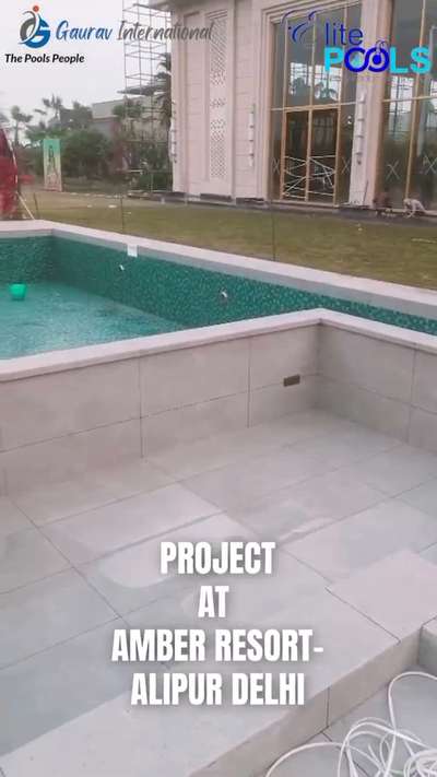 concrete swimming pool attached with kids pool