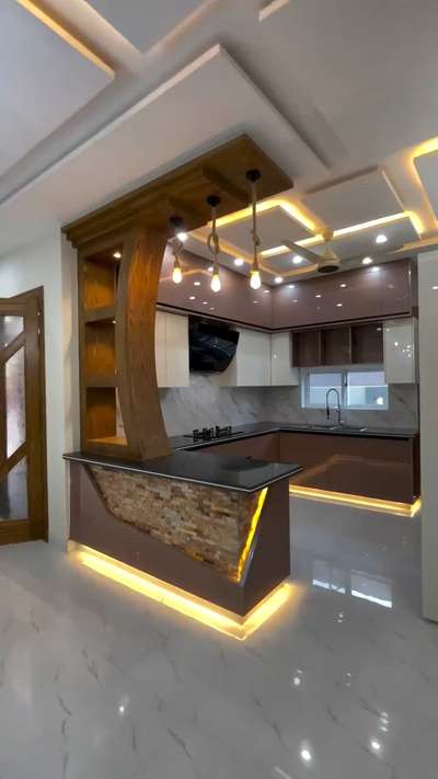 #KitchenIdeas #newkitchendesign #WoodenKitchen #KitchenRenovation #LUXURY_INTERIOR #ModularKitchen #design #LShapeKitchen #InteriorDesigner #HouseDesigns #LivingroomDesigns#Designs #noidaextension