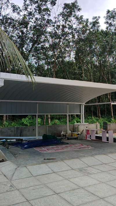 Modern carport. 
Residence for Mr sajan
location: adoor
#moderncarporch #carport #adoor #modular #design #HouseDesigns #kerala_architecture #architecturedesigns #Pathanamthitta #Contractor #frame #structure #freestanding #carporchdesign #BangaloreStone #FlooringTiles