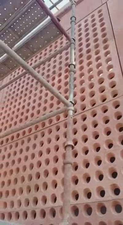 Red sand stone grid fitting mines to site