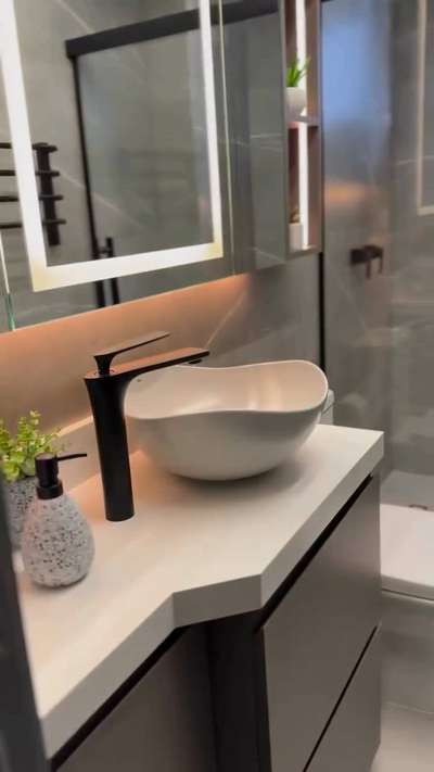 മാറ്റ് വൈറ്റ് ബേസിനും ബ്ലാക്ക് ഫിറ്റിംഗ്സും — ചെറിയ ബാത്ത്‌റൂമിന് ആധുനിക ഗ്ലാം ലുക്ക്!

ഗ്രേ ടൈൽ തീം, ബ്ലാക്ക് PVD ടാൾ ബോഡി പില്ലർകോക്ക്‌,  മാറ്റ് വൈറ്റ് ടേബിൾ ടോപ്പ് ബേസിൻ, ഗ്ലാസ് പാർട്ടീഷൻ — എല്ലാം ചേർന്നാൽ ചെറു ബാത്ത്‌റൂമും എലഗന്റ് ആൻഡ് ലക്ഷ്റി ആകും. 
LED മിററും സീലിംഗ് ലൈറ്റിംഗും ചേർന്നാൽ ബാത്ത്‌സ്പെയ്‌സ് കൂടുതൽ സ്പെയ്ഷ്യസും പ്രീമിയം ആയും തോന്നും.

 Blue North Tip:
സമയോചിതമായ ഫിറ്റിംഗ്സും കളർ കോമ്പിനേഷനും ചേർത്താൽ, ചെറിയ ബാത്ത്‌റൂം പോലും ഡിസൈൻ ഷോറൂം ലെവലിൽ എത്തിക്കാം. 

📞 Stylish fittings & premium sanitaryware ideas — feel free to DM us for design guidance!

#BathroomDesign #MattWhiteBasin #BlackFittings #PVDStyle #ModernBathroom #SmallBathroomIdeas #BlueNorth #Sanitaryware #BathFittings #LEDMirror #GlassPartition #HomeDesign #BathroomInspo #KeralaHomes #InteriorDesign #BlueNorthDesigns