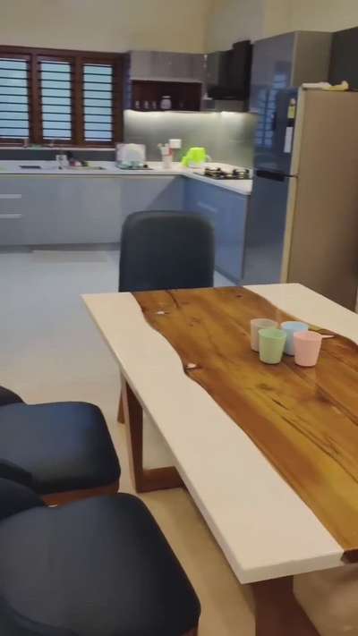 Wood just don't have to be just brown.... How about this deep white dining table to soothe your dining area!!! #interiordesigers  #woodendesign  #epoxydining  #finishedwork  #teakwoodfurniture