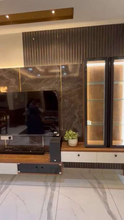 #InteriorDesigner #LivingRoomTVCabinet #WALL_PANELLING #lights #glassfinish #partitiondesign #KitchenIdeas #ModularKitchen