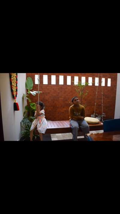Courtyard and swing make the house into a home 
#architecturedesigns #KeralaStyleHouse #architecturekerala #courtyards
